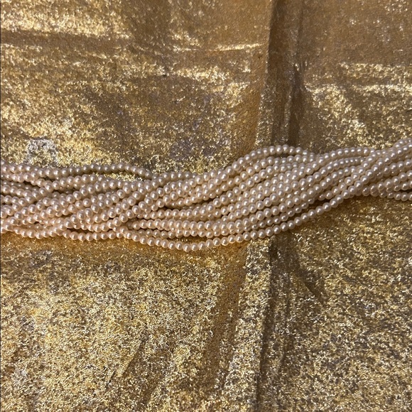 Elegant Pearl and Gold Braided Bracelet - Picture 7 of 9